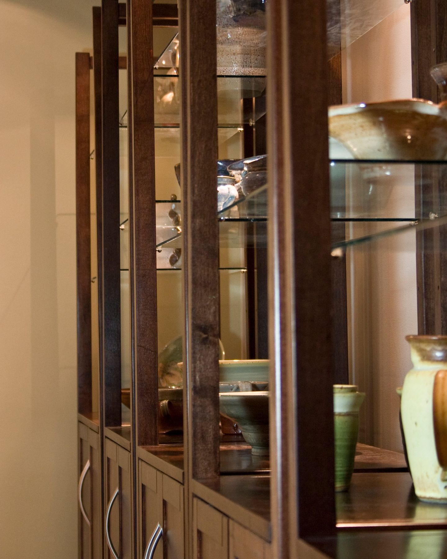 Display cabinets, Glass shelves, slim uprights, pulled handles