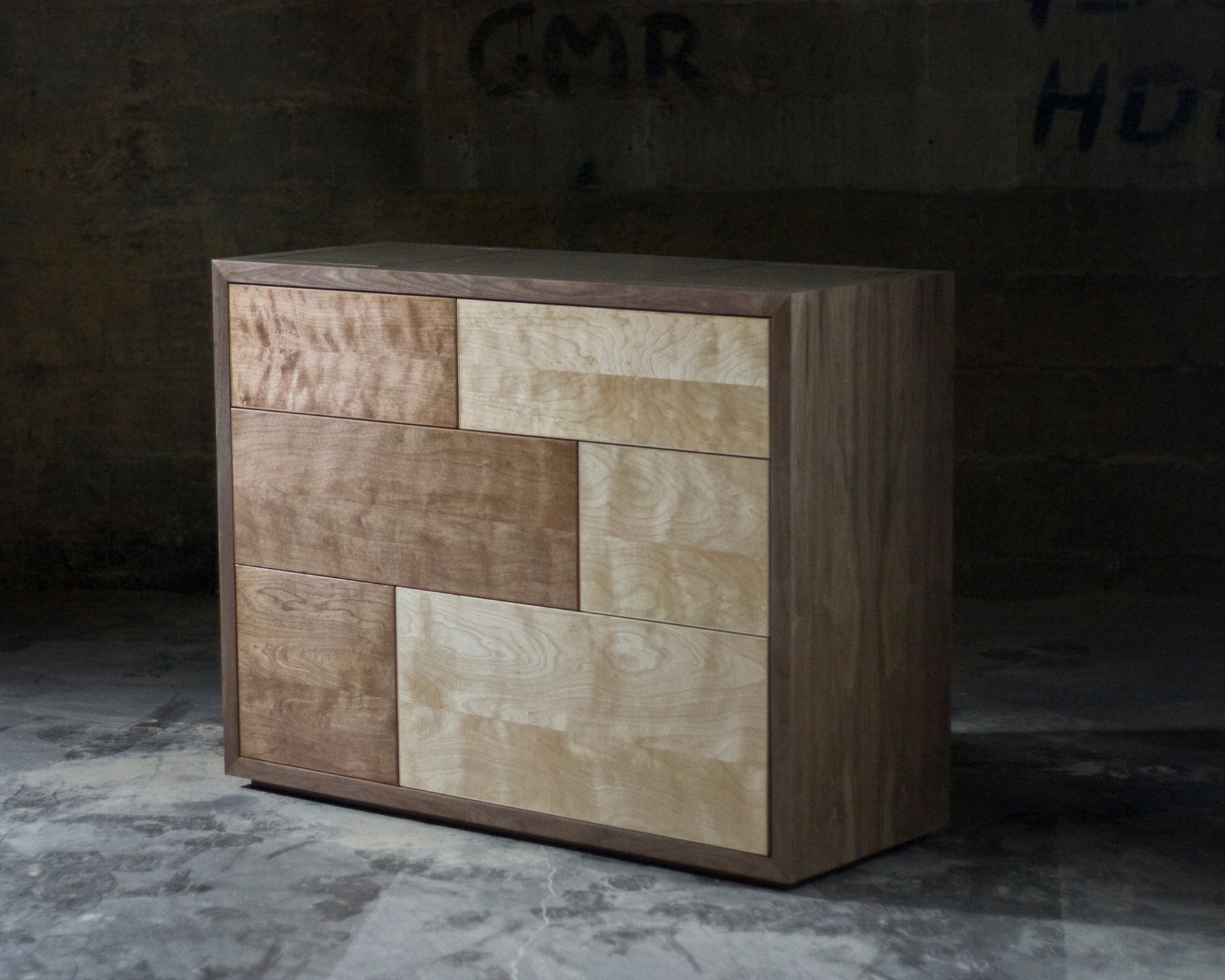 Chest of drawers, Mixed wood fronts in a frame