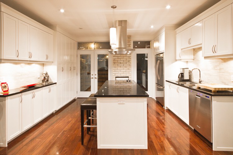 Kitchen, White shaker cabinets, dark stone island, brick chimney