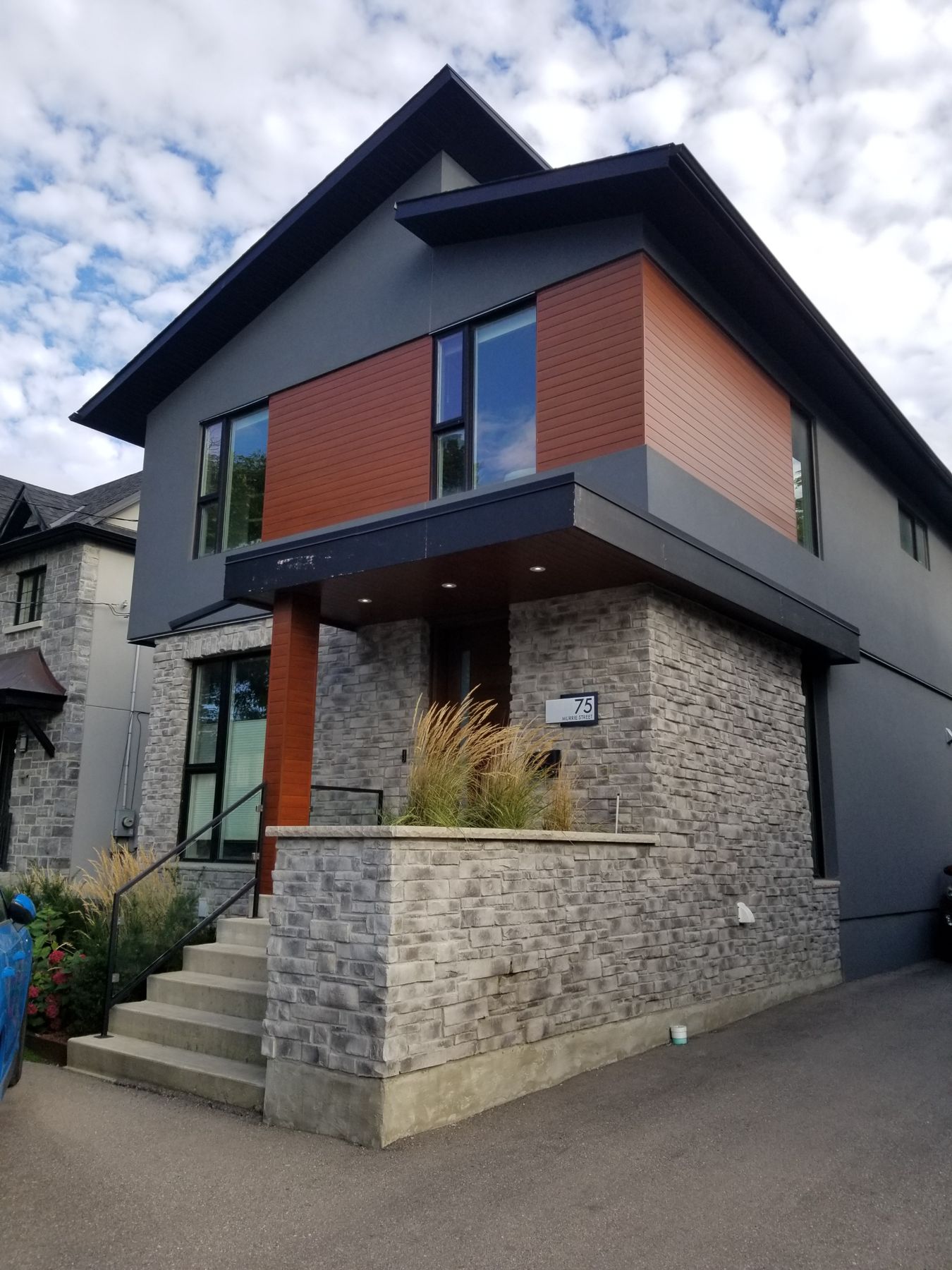 75 Murrie Street, Front elevation, stone base, stucco and cedar-clad bay